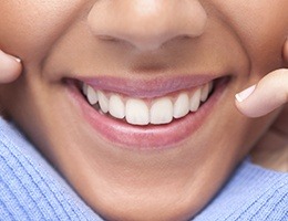 Closeup of smile with healthy teeth and gums after crown lengthening