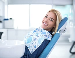 Smiling woman sitting in dental office