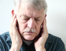 man with facial pain before TENS therapy