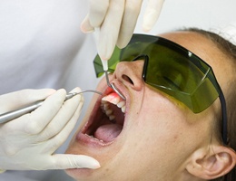 Patient receiving diode laser dentistry