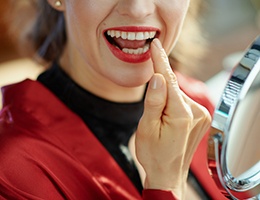 woman looking at her dental bondings