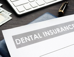 Dental insurance paperwork for the cost of dental implants in Ann Arbor