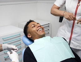 Man in dental chair after getting an impression. 